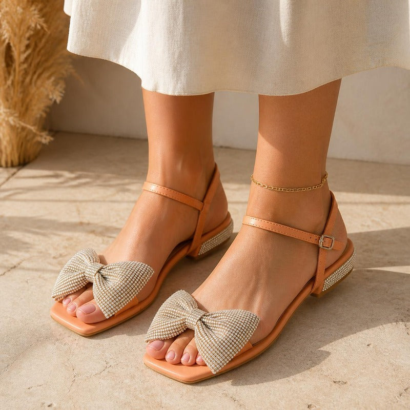 Crystal Bow Sandal in peach, worn