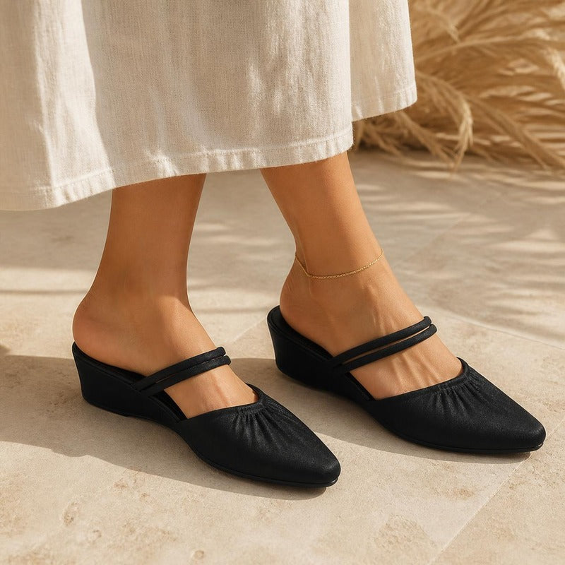 Pointed Wedge Mule in black, worn